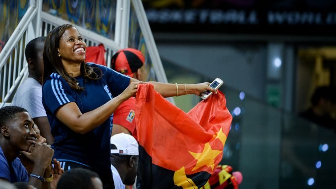 Angolan basketball team supporter with Angolan flag