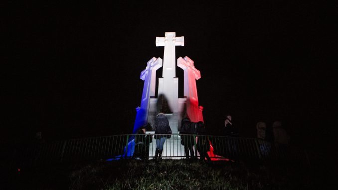 The Hill of Three Crosses in Vilnius was lit blue, white and red on Saturday evening