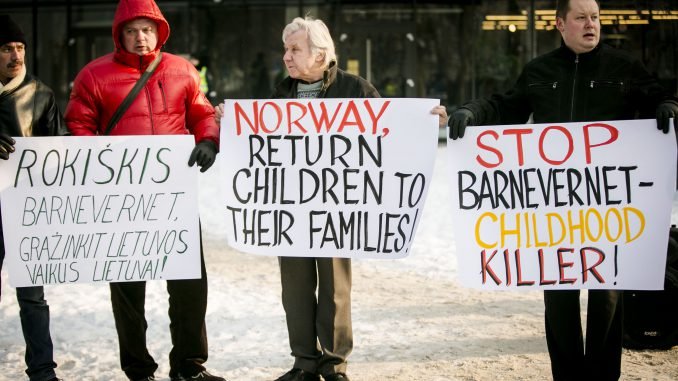 Protesters in front of the Norwegian embassy in Vilnius