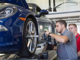 Refugee working in a car shop
