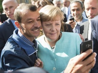 A. Merkel's selfy with a refugee