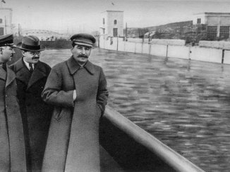 Voroshilov, Molotov, and Stalin.  Yezhov airbrushed out of history by unknow Soviet artist  Public Domain