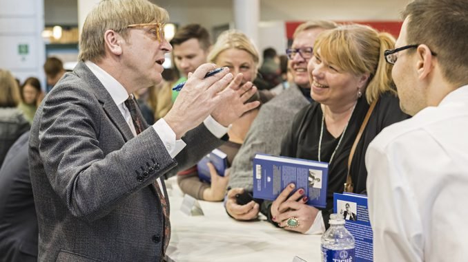 Even when signing books always the consumate politician, Guy Verhofstadt at the  Vilnius Book Fair  Photo © Ludo Segers @ The Lithuania Tribune